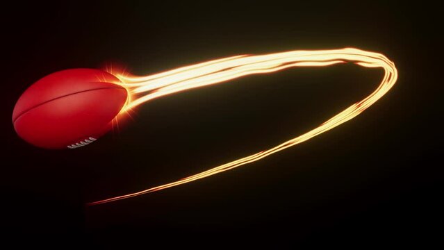 A australian rules sport ball swooping in an arc shape through the air with a flowing travelling trail of glowing wispy lights on an isolated black background with alpha channel
