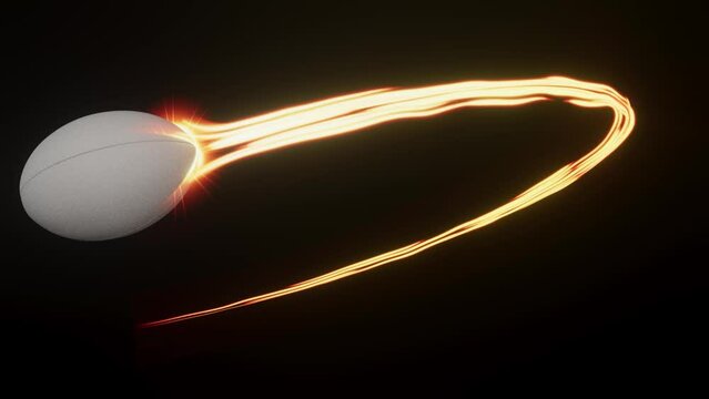 A rugby sport ball swooping in an arc shape through the air with a flowing travelling trail of glowing wispy lights on an isolated black background with alpha channel