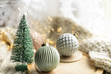 Cozy winter still life, Christmas decorations on cozy blanket.