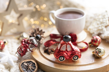 Winter composition with a cup of cocoa and marshmallows on a blurred background.
