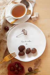 Obraz na płótnie Canvas Candied chestnut on a plate on the table