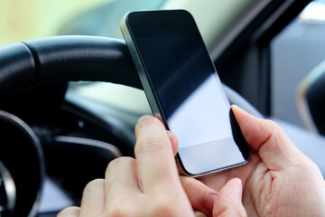 image of using a mobile phone inside of a car