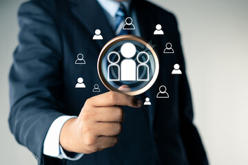 Human Resource Management Network Structure, social media. Digital marketing online. Businessman use magnifying glass to find human icon for business Customer Relation Management, customer target