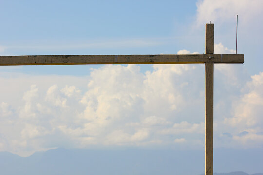 wooden beam over blue sky with clouds