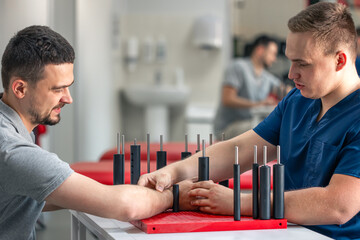 Development of movements of the radial wrist joint on a functional board for the hand.