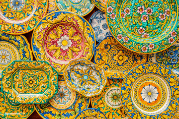 Background with decorated and colorful porcelain plates