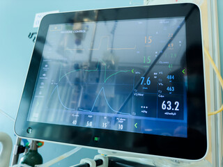 hospital monitor displaying vital signs like heart rate, blood pressure, and oxygen levels,...