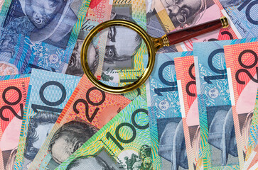 Australian dollars in fan on wooden table
