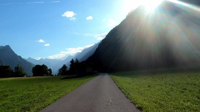 Mountains in Austria at the Brenner Pass at dusk with meadows and forests in 4k