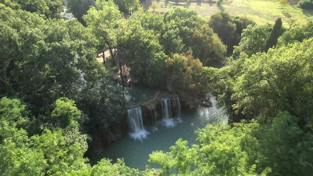 4K aerial drone shot falling into waterfall, Parco Fluviale Val d'Elsa, Tuscany, Italy