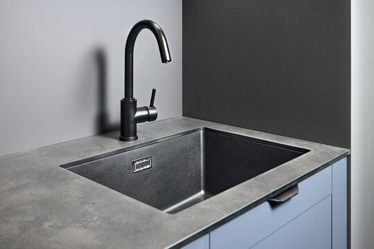 Single handle water filter kitchen faucet for reverse osmosis or water filtration system built in compact high pressure laminate HPL countertop. Kitchen undermount installation granite composite sink.