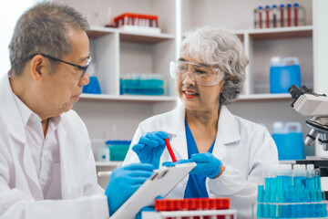 Mature physician asian man and woman people in comprehensive presentation on medical insurance, health lab test results, empowering patients with knowledge. physician expert advice on health coverage