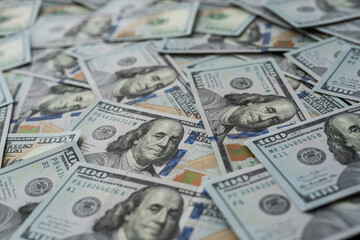 Finance background of new 100 dollar bills, pile of money. Us banknote