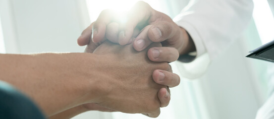 psychiatrist hold hand support each while discussing family issues. doctor encourages and empathy...