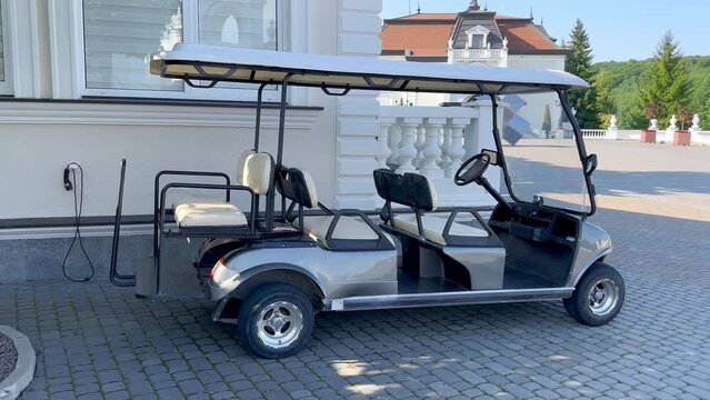A golf cart near the golf club