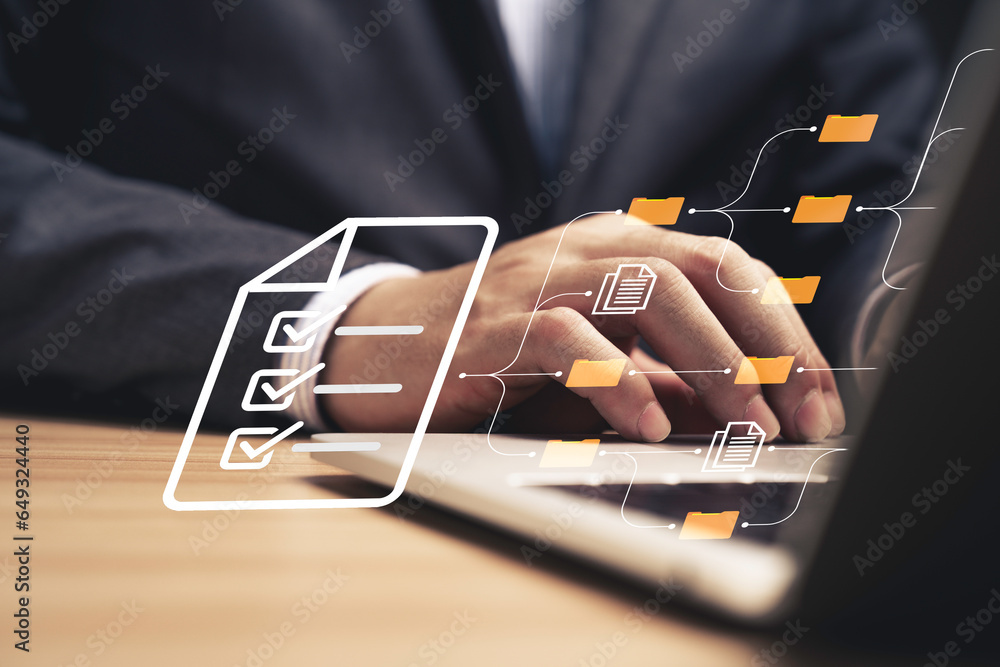 Poster Businessman using laptop computer and touching to online electronic paper for approve ISO quality document control certification and project approval concept.