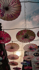 In a small town in Hangzhou, China, colorful umbrellas line the streets