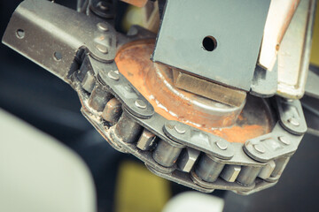 Metal chain and gear in agricultural or industrial machine. Technology