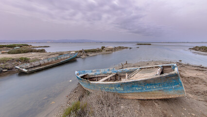 Fototapeta premium Wrecks of fishing boats in natural harbour