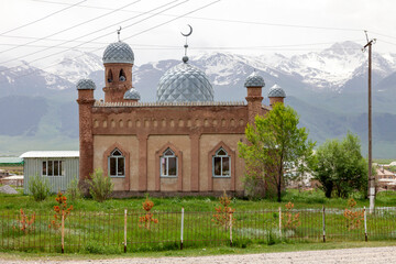 small mosque in a village at the foot of the mountains in Central Asia