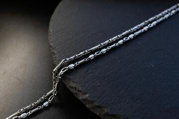 Macro shot of silver chain, black background