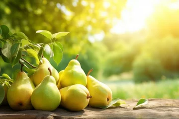 Foto op Canvas pears on the table with green leaves in a sunny summer garden with summer sun © vasyan_23
