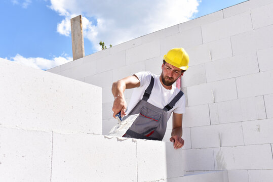 profession construction worker - work on a building site construction of a residential house
