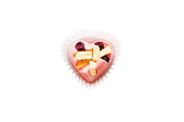 top view of chocolate pralines in heart form isolated on white background