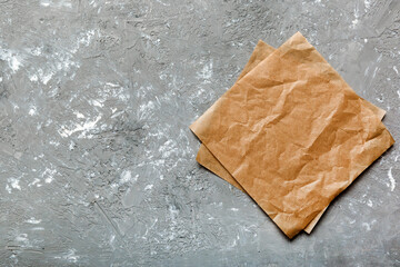 top view with baking parchment empty on table background. Folded cloth for mockup with copy space, Flat lay. Minimal style
