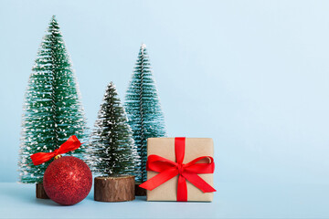 Christmas composition. craft Gift box, small tree, branches and craft DIY decorations on white background. New year concept. Christmas home decoration Flat lay, top view, copy space