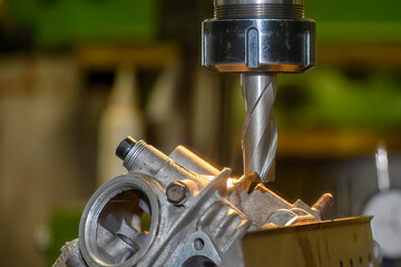 The milling process on NC milling machine with motorcycle cylinder head parts.