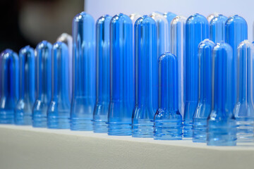 Close up scene of group of preform shape of PET bottle products.