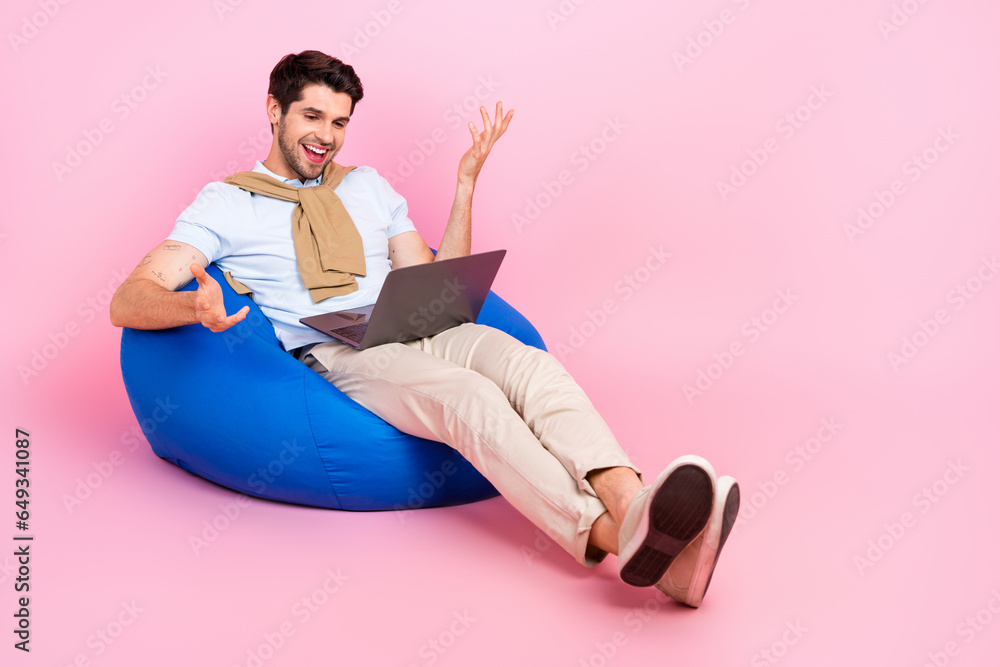 Aufkleber full size photo of positive person sit cozy bag communicate video call netbook empty space isolated 