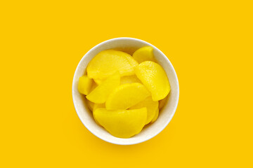 Sweet and tart slices of yellow pickled daikon, known as takuan in Japan and danmuji in Korea.