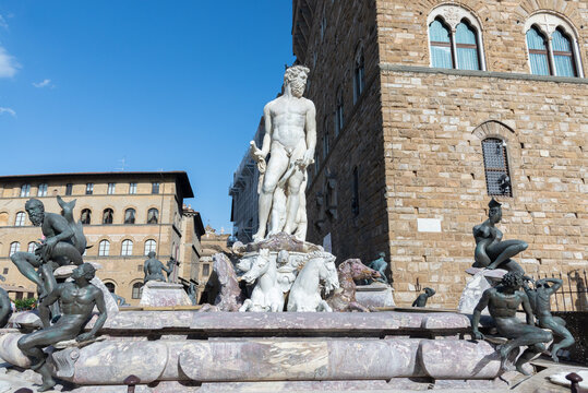 statues of the Neptune fountain in Florence, Italy