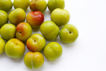 Fresh green plum on white background
