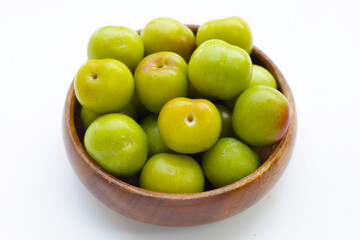 Fresh green plum on white background