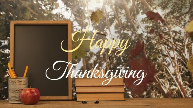 Animation of happy thanksgiving text over chalkboard, pen stand, stack of books, apple against park