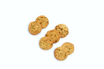 Pistachio and almond cookies on white background.