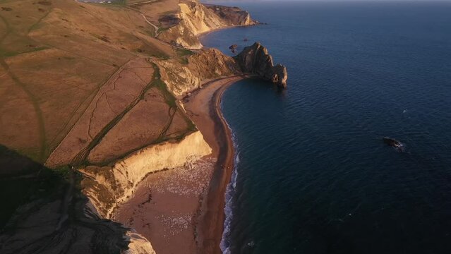 Aerial video of the Dordal Dor beach at sunrise, Dorset, England