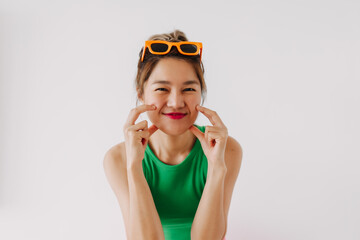 Happy Asian woman wear colorful outfit cute charming posing isolated.