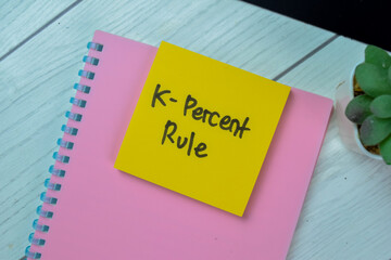 Concept of K-Percent Rule write on sticky notes isolated on Wooden Table.