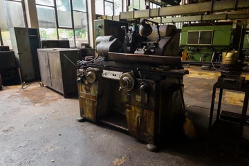Fototapeten Verlassene Gebäude Workshop machines inside abandoned factory  © AlexDej