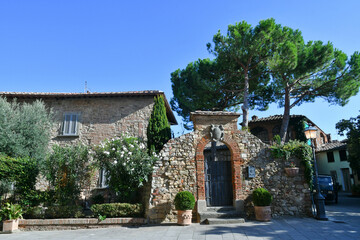 The gate of an old house in the medieval quarter of Lucignano, a village in Tuscany, Italy.