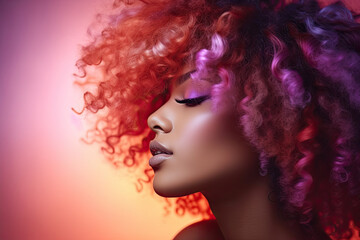Obraz na płótnie Canvas Woman with gradient orange purple natural afro-textured curly hair. Healthy hair. 