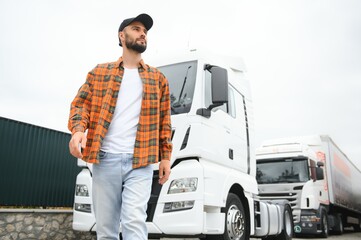 Men driver near lorry truck. Man owner truck driver near truck. Man trucker trucking owner....