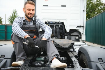 Male Mechanic repairing the truck