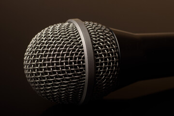 Close-up of microphone on a black background