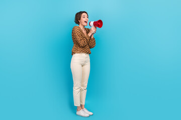 Photo of excited lady promoter using loud speaker for sharing incredible news isolated blue color background