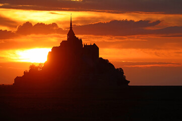 Breathtaking View with Abbey of Mont Saint Michel in Northern France at sunset - 649395477
